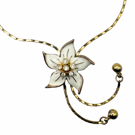 Vintage Gold-tone and white enamelled floral slide lariat necklace set with rhinestones.