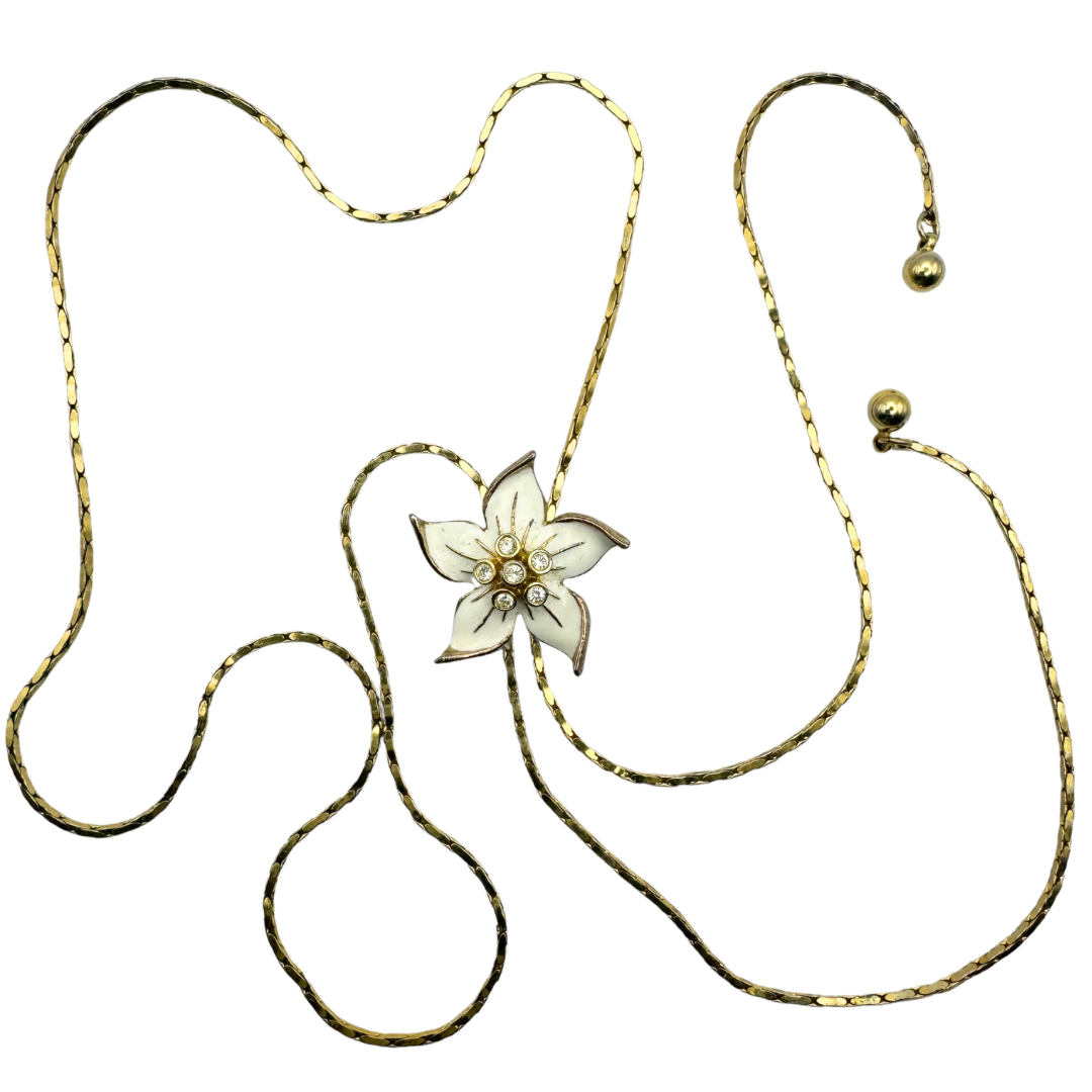 Vintage Gold-tone and white enamelled floral slide lariat necklace set with rhinestones.